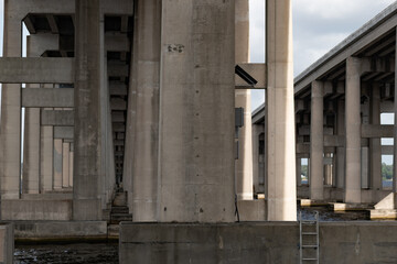 View of the bottom side of a bridge showing the supporting structure.