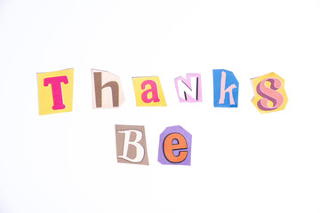 Fun cut out newspaper style typescript with phrase Thanks Be. Isolated on clean white background. Gratitude and Thanks concept.