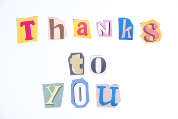 Fun cut out newspaper style typescript with phrase Thanks to You. Isolated on clean white background. Gratitude and Thanks concept.