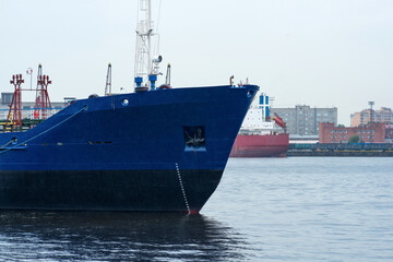 ships in a cargo port on a cloudy day