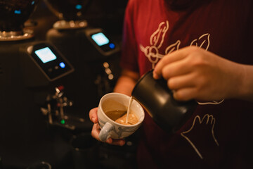 In bustling cafes, the barista crafted a hot drink, blending rich espresso and steamed milk into a latte adorned with intricate art, making each sip a delightful experience.
