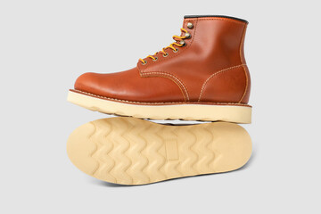 Brown leather boots on white background. Fashion 