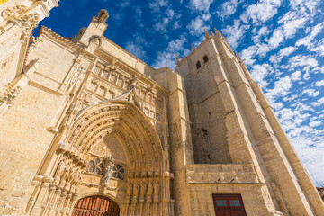 Low angle view of the southern facade of the Catholic Cathedral in the Gothic style of Palencia in Castilla y León Region, Spain