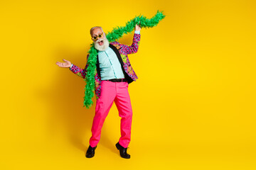 Full body portrait of positive aged man wear pink trousers necklace empty space isolated on yellow color background