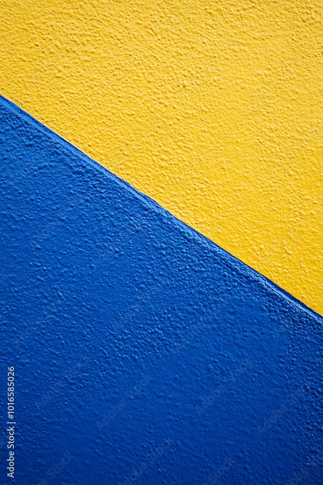 Poster dynamic blue and yellow abstract geometric background featuring bold diagonal shapes and patterns, c