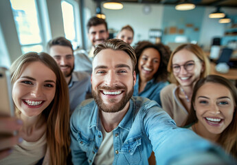 Diverse group of smiling people taking a selfie in the office