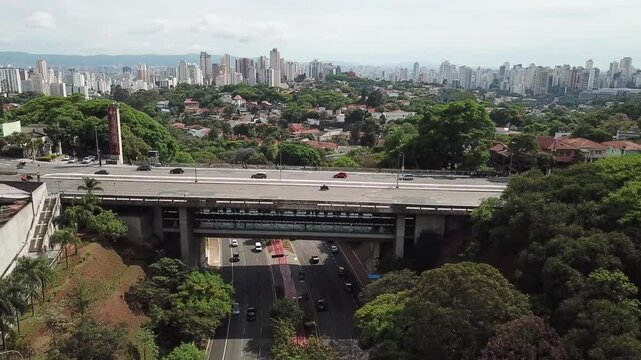 Drone view of traffic and greenery along Sumare Avenue, S&atilde;o Paulo