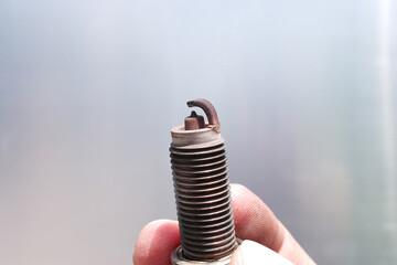 Dirty and damaged spark plugs , close up of old spark plugs of car combustion engine in the hands...