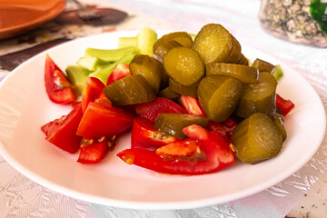 View of pickled fresh vegetables on a plate.