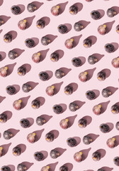 Seamless Pattern of Halved Fresh Figs on Light Pink Background