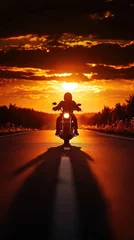 Acrylglasbilder Braun A silhouette of a motorcycle against a vibrant sunset, highlighting freedom and adventure on an open road.  © Kitta Studio