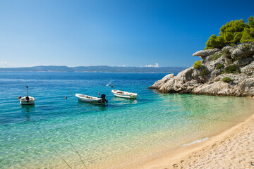 Crystal clear water on pebbel beach in Brela, Croatia