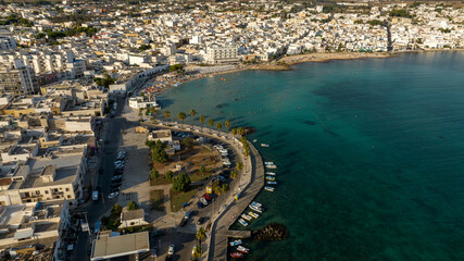 Obraz premium Aerial view Porto Cesareo promenade. It is a small city on the Mediterranean Sea in the province of Lecce in Puglia, Italy. It is a tourist town located on the Ionian coast of the Salento peninsula.