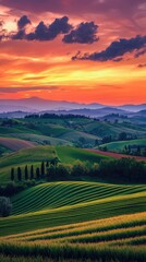 Obraz premium Breathtaking sunset over rolling hills, showcasing vibrant greens and dramatic clouds, perfect for landscape lovers and nature enthusiasts.
