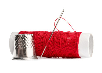Thimble and needle with red sewing thread isolated on white