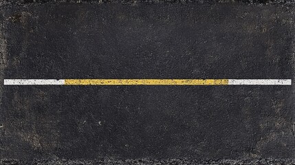 Fototapeta premium A minimalist view of a black asphalt road featuring a single yellow and white line running across. Ideal for themes of direction and movement.