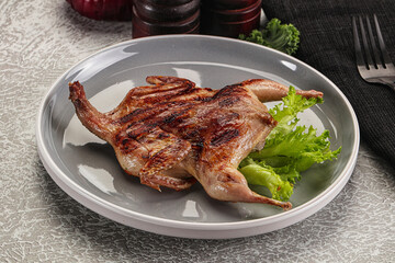 Grilled quail in the plate