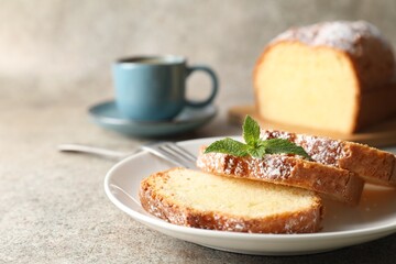 Freshly baked sponge cake and coffee on light grey table, closeup