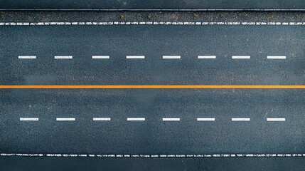 Aerial view of a straight road featuring dashed white lines and an orange center line, showcasing the smooth surface and design.
