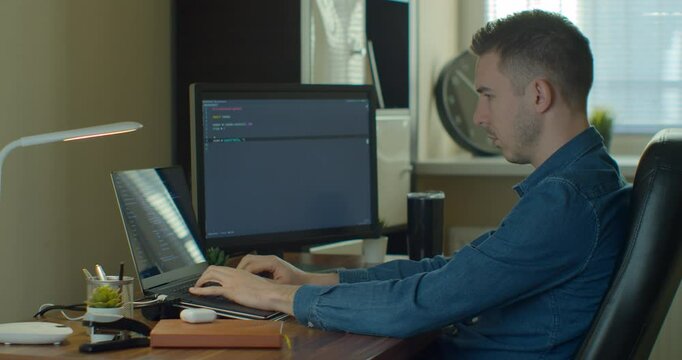 Man coding html and programming on screen Monitors, development web, developer.