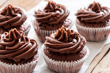 White and chocolate cupcakes on a. Food cake dessert concept. A white with chocolate and sweet cupcakes. White and chocolate cupcakes on a of sweets lifestyle.