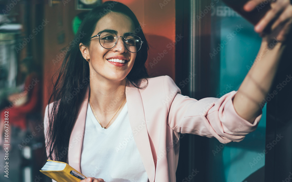 Poster cheerful woman in optical spectacles for provide eyes protection smiling at camera and clicking self