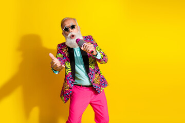 Photo portrait of attractive retired man star sunglass sing karaoke dressed colorful pink fancy...
