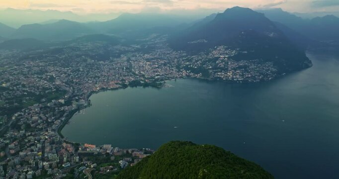 Aerial view of Lugano city and lugano lake from San Salvatore mountain. Aerial footage of the Monte Bre overlooking the city of Lugano in Canton Ticino in Switzerland