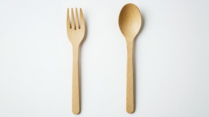 Pair of recyclable plastic fork and spoon set in a natural shade, laid on a white background for green takeaway options.