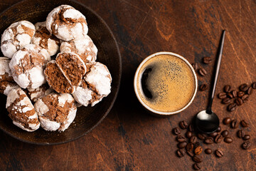 chocolate coffee cookies with cracks and coffee