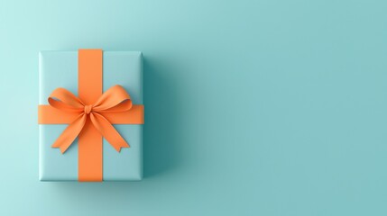 Gift box with orange ribbon on a blue background for festive occasions.