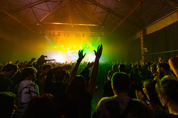 Audience silhouette on the concert background,