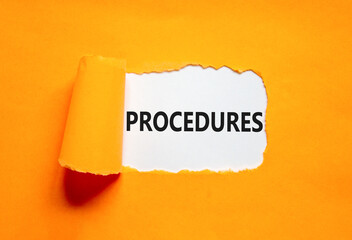 Procedures symbol. Concept word Procedures on beautiful white paper. Beautiful orange paper background. Business procedures concept. Copy space.