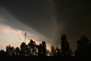 Cloudy and stormy weather before the storm with a sun set