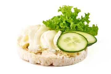 Rice cake with cream cheese, cucumber and lettuce, isolated on white background.