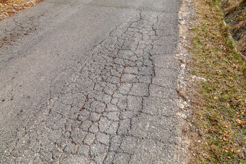 road from broken and destroyed asphalt unsuitable for driving