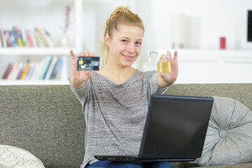 woman holding credit card with padlock