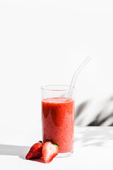 smoothie with strawberries and a glass tube