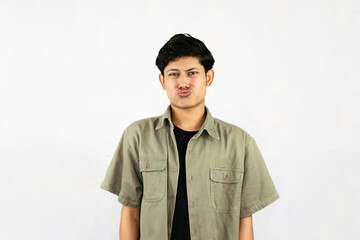 Frustrated, Irritated and Angry Young Asian Male Handsome Student Boy saying no gestures expressions