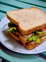 Fresh vegetable sandwich on white bread, healthy lunch, homemade food on rustic table