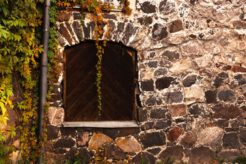old stone wall with window