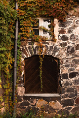 old stone wall with windows