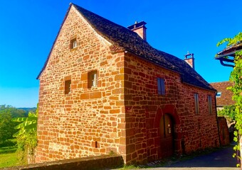 Fototapeta premium charming red brick architecture in the village of Collonges-la-Rouge in France