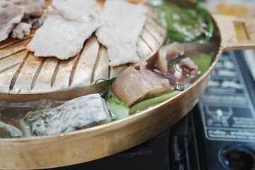 Thai Suki BBQ with Meat, Seafood and Vegetables on a Hot Grill