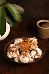 chocolate coffee cookies with cracks and coffee