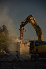 demolition of the bridge with construction equipment