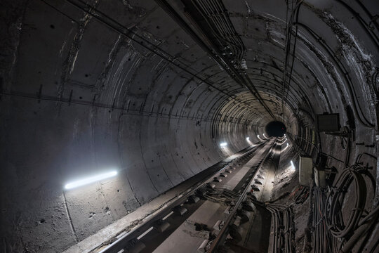 Fototapeta straight circular subway tunnel with a white lighting