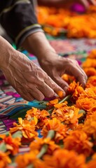 Close-Up of Hands Weaving Cempasuchil Flowers for Dia de los Muertos Altar - Traditional Mexican Craft