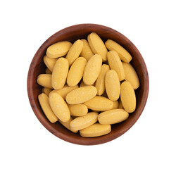 pills in wooden bowl isolated