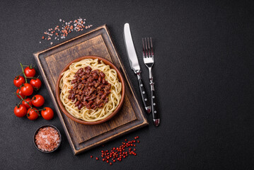 Rice noodles with beans, meat, tomato sauce, spices and herbs